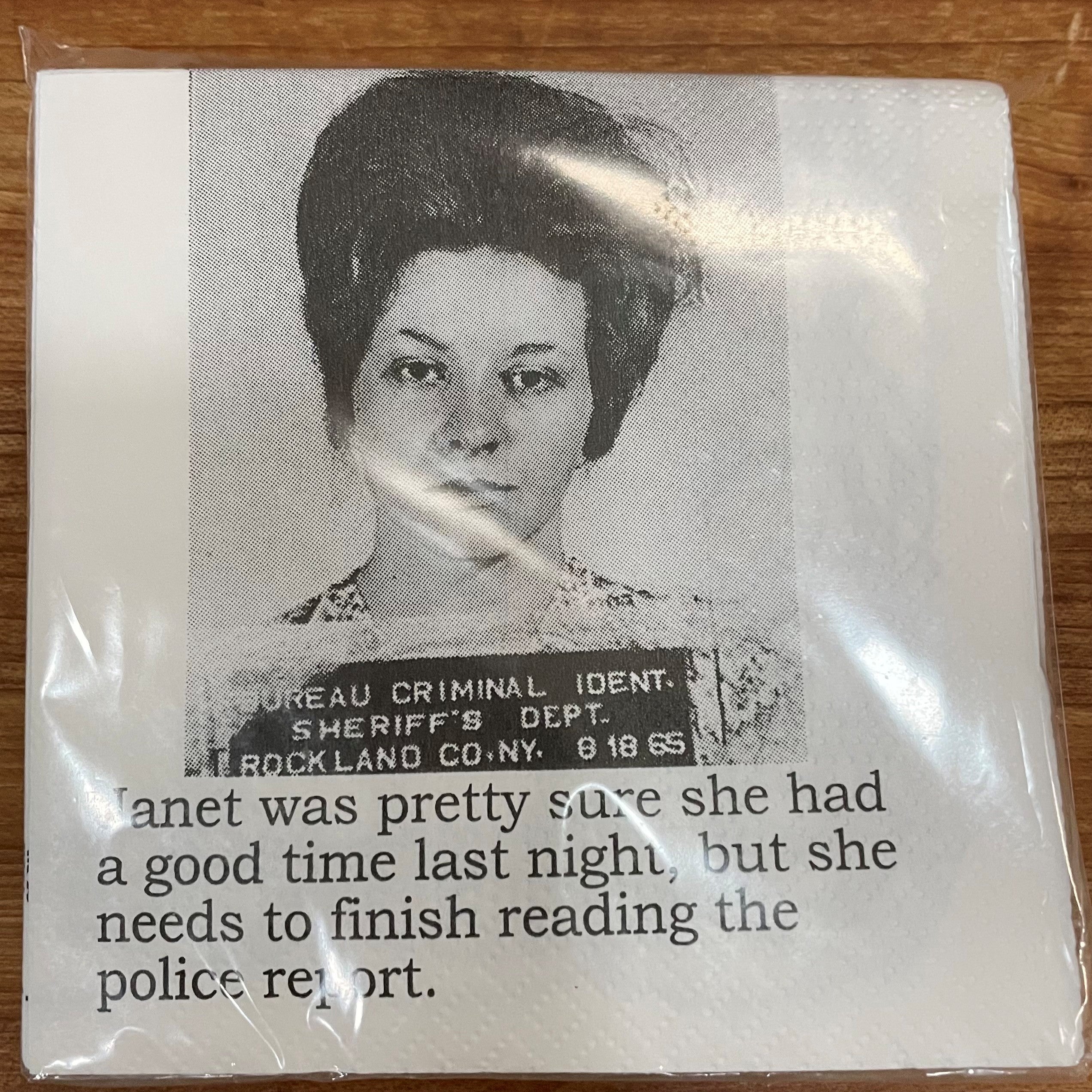 Big House Napkins, Janet was pretty sure she had a good time last night, but she needs to finish reading the police report.